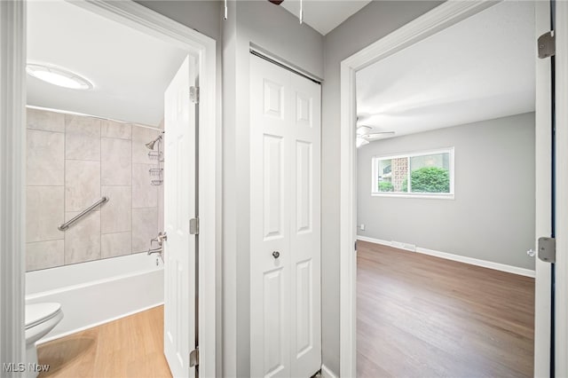 1372 Golden Gate Blvd, Mayfield Heights, OH 44124 - full bathroom featuring ceiling fan, wood finished floors, and bathing tub / shower combination