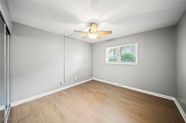 1372 Golden Gate Blvd, Mayfield Heights, OH 44124 - empty room with ceiling fan and wood finished floors
