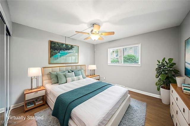 1372 Golden Gate Blvd, Mayfield Heights, OH 44124 - bedroom with wood finished floors, a ceiling fan, and a closet