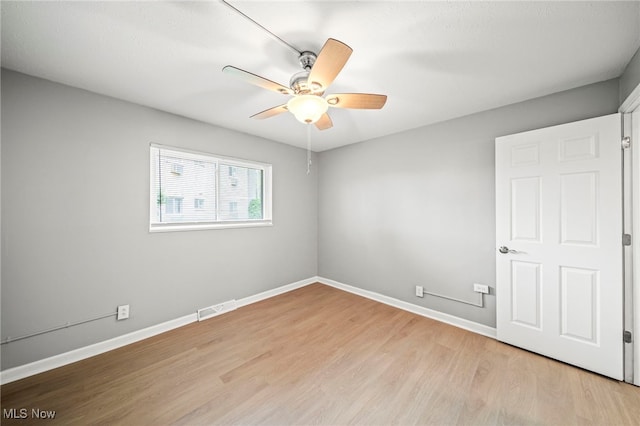 1372 Golden Gate Blvd, Mayfield Heights, OH 44124 - spare room featuring a ceiling fan and light wood-type flooring