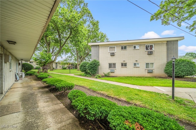 1372 Golden Gate Blvd, Mayfield Heights, OH 44124 - view of home's exterior with brick siding and a yard