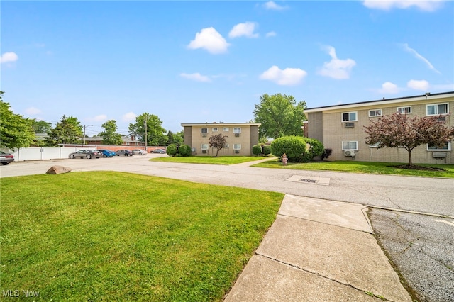 1372 Golden Gate Blvd, Mayfield Heights, OH 44124 - view of front of property with uncovered parking and a front yard