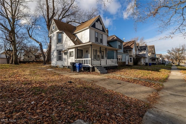 3888 W 37th St, Cleveland, OH 44109 - view of front of home with covered porch, a residential view, and a shingled roof