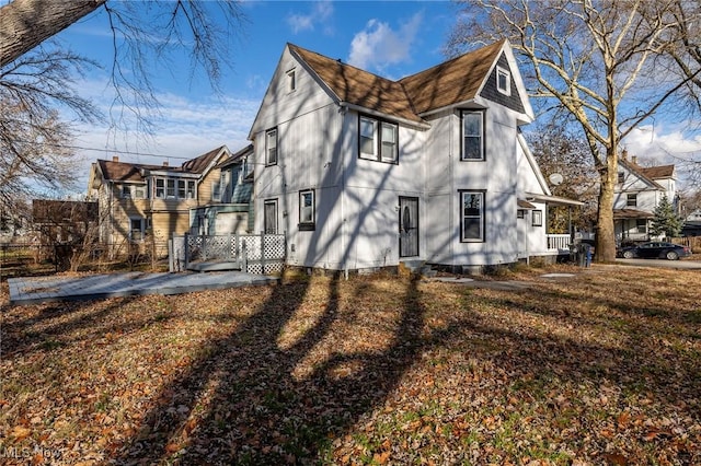 3888 W 37th St, Cleveland, OH 44109 - view of side of home with roof with shingles