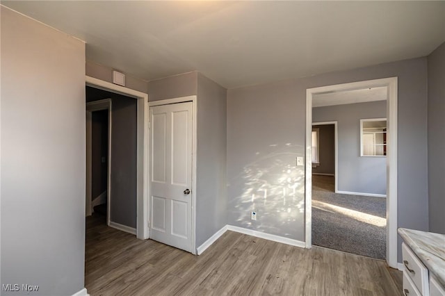 3888 W 37th St, Cleveland, OH 44109 - unfurnished bedroom with light wood finished floors and a closet