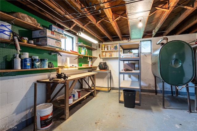 15459 Serfass Rd, Doylestown, OH 44230 - basement featuring a workshop area, oil tank, and concrete block wall