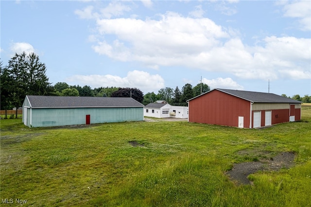 15459 Serfass Rd, Doylestown, OH 44230 - view of grassy yard featuring an outbuilding, a garage, and an outdoor structure