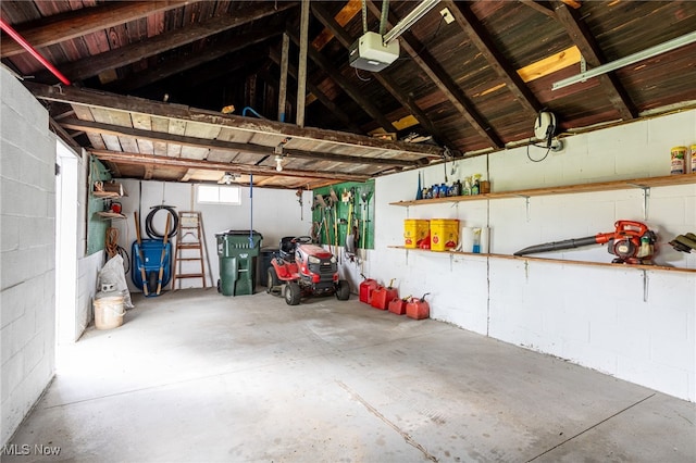 15459 Serfass Rd, Doylestown, OH 44230 - garage featuring a garage door opener and concrete block wall