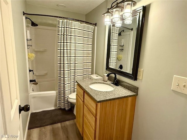 1550 Swift Rd, Waterford, OH 45786 - bathroom with vanity, wood finished floors, shower / tub combo with curtain, and a chandelier