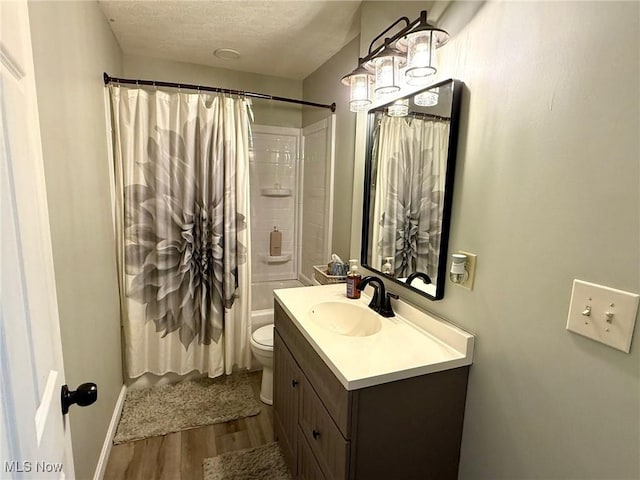 1550 Swift Rd, Waterford, OH 45786 - full bathroom with wood finished floors, vanity, a textured ceiling, and shower / tub combo