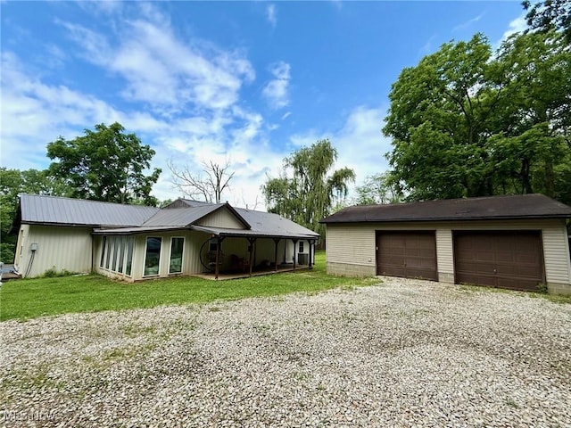 1550 Swift Rd, Waterford, OH 45786 - view of front of property with a detached garage, a front lawn, and an outdoor structure