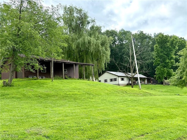 1550 Swift Rd, Waterford, OH 45786 - view of grassy yard featuring an outbuilding and an outdoor structure
