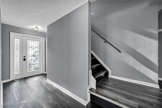7569 Lake Shore Blvd, Madison, OH 44057 - foyer entrance featuring wood finished floors and a textured ceiling