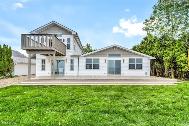 7569 Lake Shore Blvd, Madison, OH 44057 - back of house with a lawn and a deck