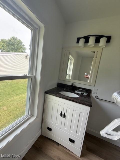 637 Maple St, Newcomerstown, OH 43832 - bathroom featuring vanity and wood finished floors