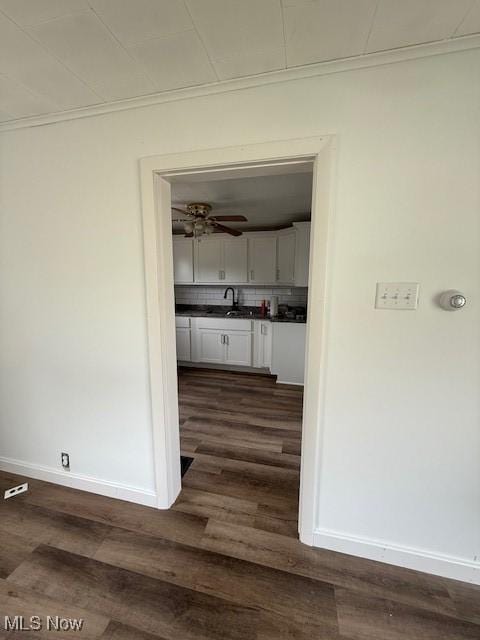 637 Maple St, Newcomerstown, OH 43832 - corridor with crown molding and dark wood-style flooring