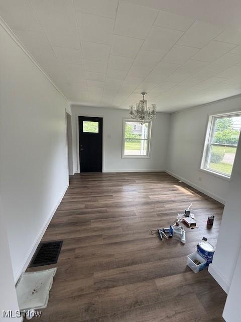637 Maple St, Newcomerstown, OH 43832 - foyer featuring a chandelier and wood finished floors
