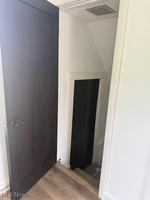 637 Maple St, Newcomerstown, OH 43832 - corridor with wood finished floors and vaulted ceiling