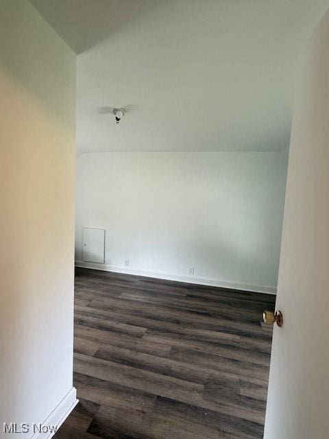 637 Maple St, Newcomerstown, OH 43832 - spare room featuring dark wood-style floors and baseboards
