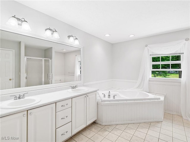 32969 Durrell Ave, Avon Lake, OH 44012 - bathroom featuring wainscoting, double vanity, a stall shower, a garden tub, and tile patterned flooring