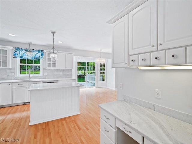 32969 Durrell Ave, Avon Lake, OH 44012 - kitchen with light wood-style floors, glass insert cabinets, tasteful backsplash, white cabinetry, and recessed lighting