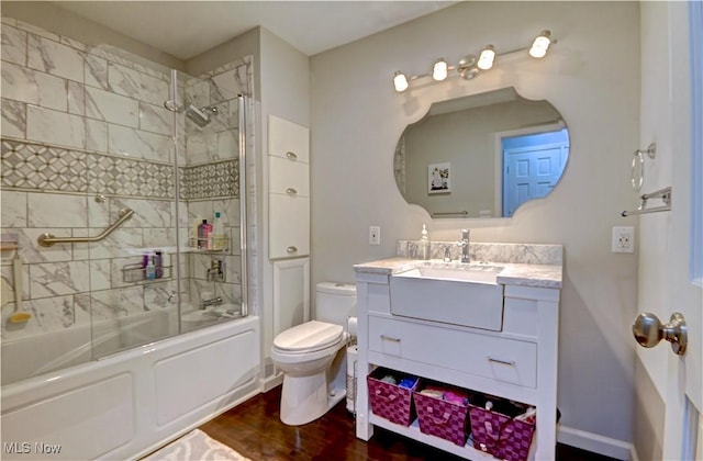 27008 Sweetbriar Dr, North Olmsted, OH 44070 - bathroom with vanity, combined bath / shower with glass door, and wood finished floors