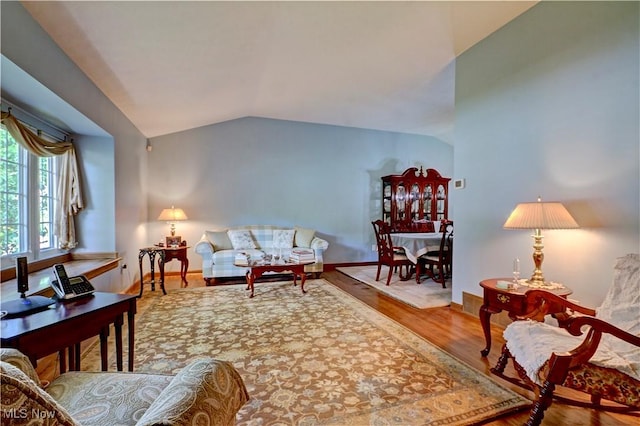 27008 Sweetbriar Dr, North Olmsted, OH 44070 - living room with lofted ceiling and wood finished floors