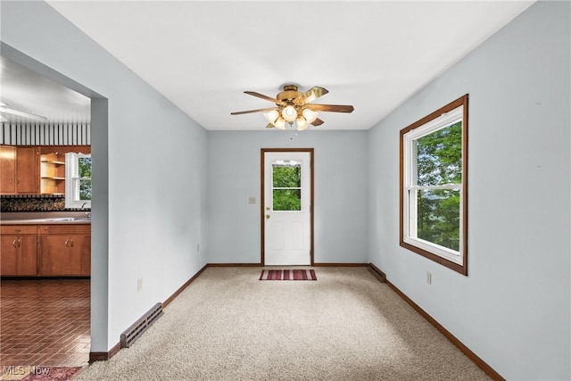 59937 Broadview Rd, Shadyside, OH 43947 - unfurnished room featuring a ceiling fan and carpet flooring