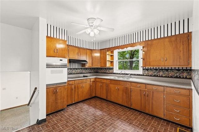 59937 Broadview Rd, Shadyside, OH 43947 - kitchen with white oven, open shelves, brown cabinets, a ceiling fan, and under cabinet range hood
