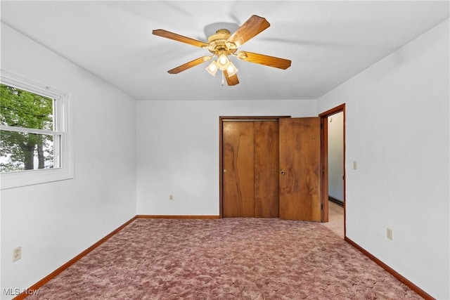 59937 Broadview Rd, Shadyside, OH 43947 - unfurnished bedroom featuring a closet, carpet flooring, and ceiling fan