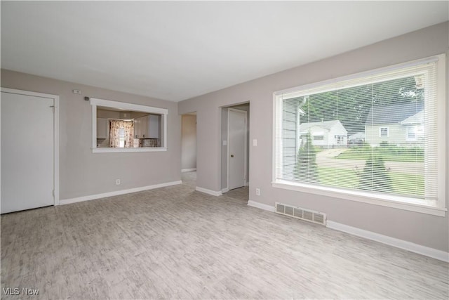 810 Indian Trl, Akron, OH 44314 - empty room featuring wood finished floors and baseboards
