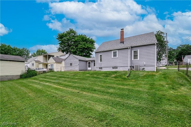 810 Indian Trl, Akron, OH 44314 - rear view of house featuring a chimney and a shingled roof