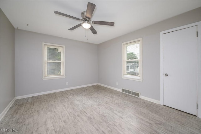 810 Indian Trl, Akron, OH 44314 - unfurnished bedroom featuring wood finished floors and ceiling fan