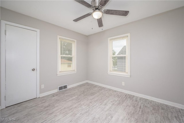 810 Indian Trl, Akron, OH 44314 - unfurnished room featuring wood finished floors and ceiling fan