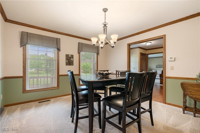 6884 Mapleridge Cir NW, Canton, OH 44718 - dining area featuring a chandelier and crown molding