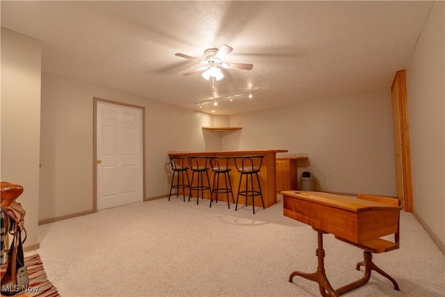 6884 Mapleridge Cir NW, Canton, OH 44718 - sitting room with a dry bar, ceiling fan, and carpet flooring