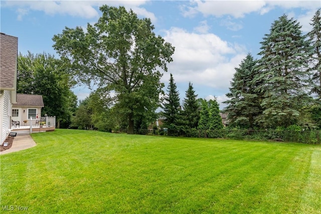 6884 Mapleridge Cir NW, Canton, OH 44718 - view of green lawn featuring a wooden deck
