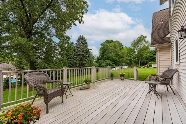 6884 Mapleridge Cir NW, Canton, OH 44718 - deck with a lawn and view of wooded area