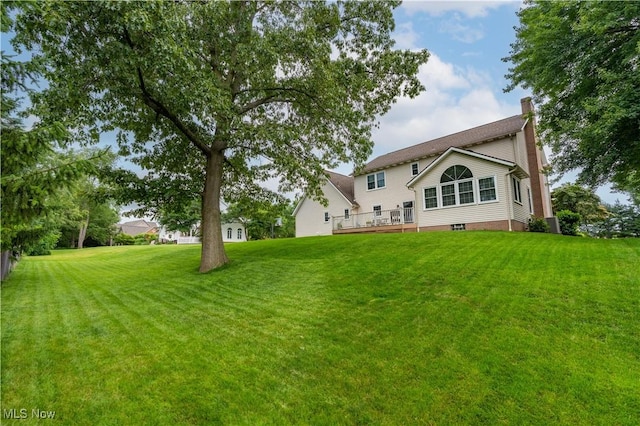 6884 Mapleridge Cir NW, Canton, OH 44718 - back of house with a chimney, a yard, and a deck
