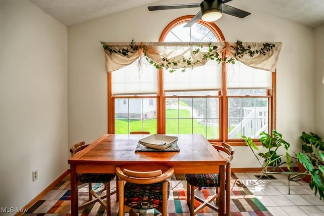 6202 Rockside Cir NW, Canton, OH 44718 - tiled dining space featuring vaulted ceiling and a ceiling fan