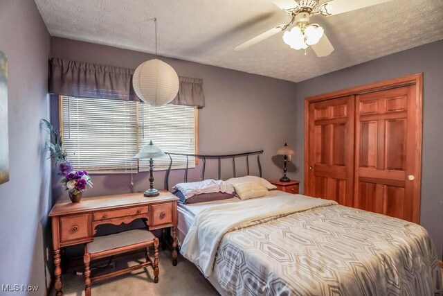 6202 Rockside Cir NW, Canton, OH 44718 - bedroom featuring carpet flooring, a closet, and a ceiling fan