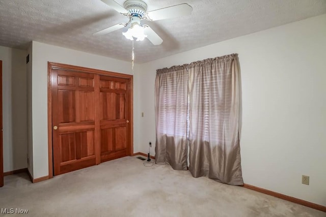 6202 Rockside Cir NW, Canton, OH 44718 - unfurnished bedroom with carpet, a textured ceiling, ceiling fan, and a closet