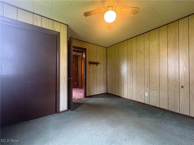 2178 Hewitt Gifford Rd SW, Warren, OH 44481 - carpeted empty room with ceiling fan and wood walls