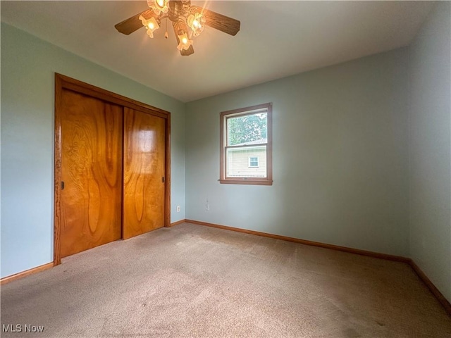 2178 Hewitt Gifford Rd SW, Warren, OH 44481 - unfurnished bedroom featuring carpet flooring, a closet, and a ceiling fan