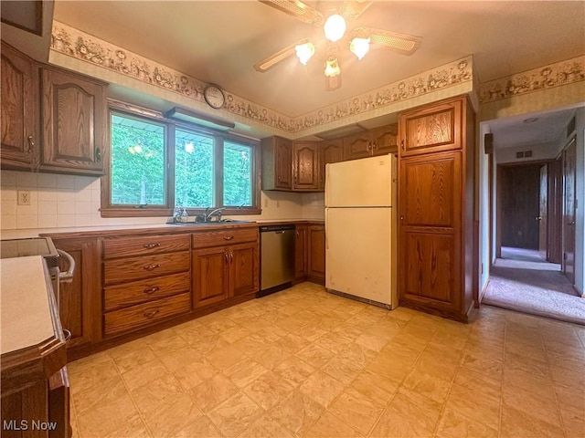 2178 Hewitt Gifford Rd SW, Warren, OH 44481 - kitchen with freestanding refrigerator, dishwasher, light flooring, a ceiling fan, and brown cabinetry