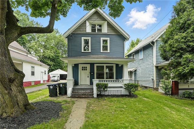 848 Kling St, Akron, OH 44311 - american foursquare style home featuring a porch and a front lawn