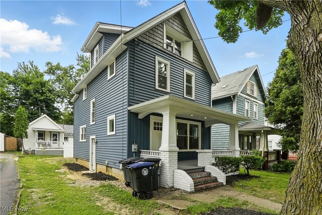 848 Kling St, Akron, OH 44311 - view of front of house featuring covered porch and a front yard