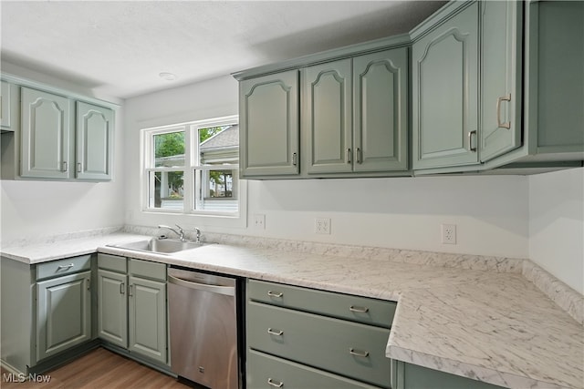 848 Kling St, Akron, OH 44311 - kitchen featuring stainless steel dishwasher, green cabinets, light countertops, and dark wood-style flooring