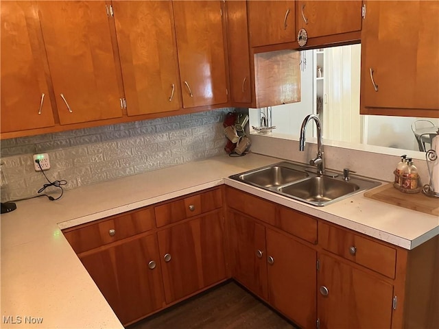 723 High Ave, Niles, OH 44446 - kitchen featuring light countertops, backsplash, and brown cabinetry