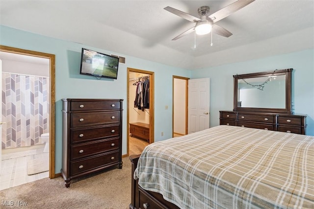 1012 Woodland Chase, Grafton, OH 44044 - bedroom with light carpet, ensuite bathroom, a spacious closet, a closet, and ceiling fan